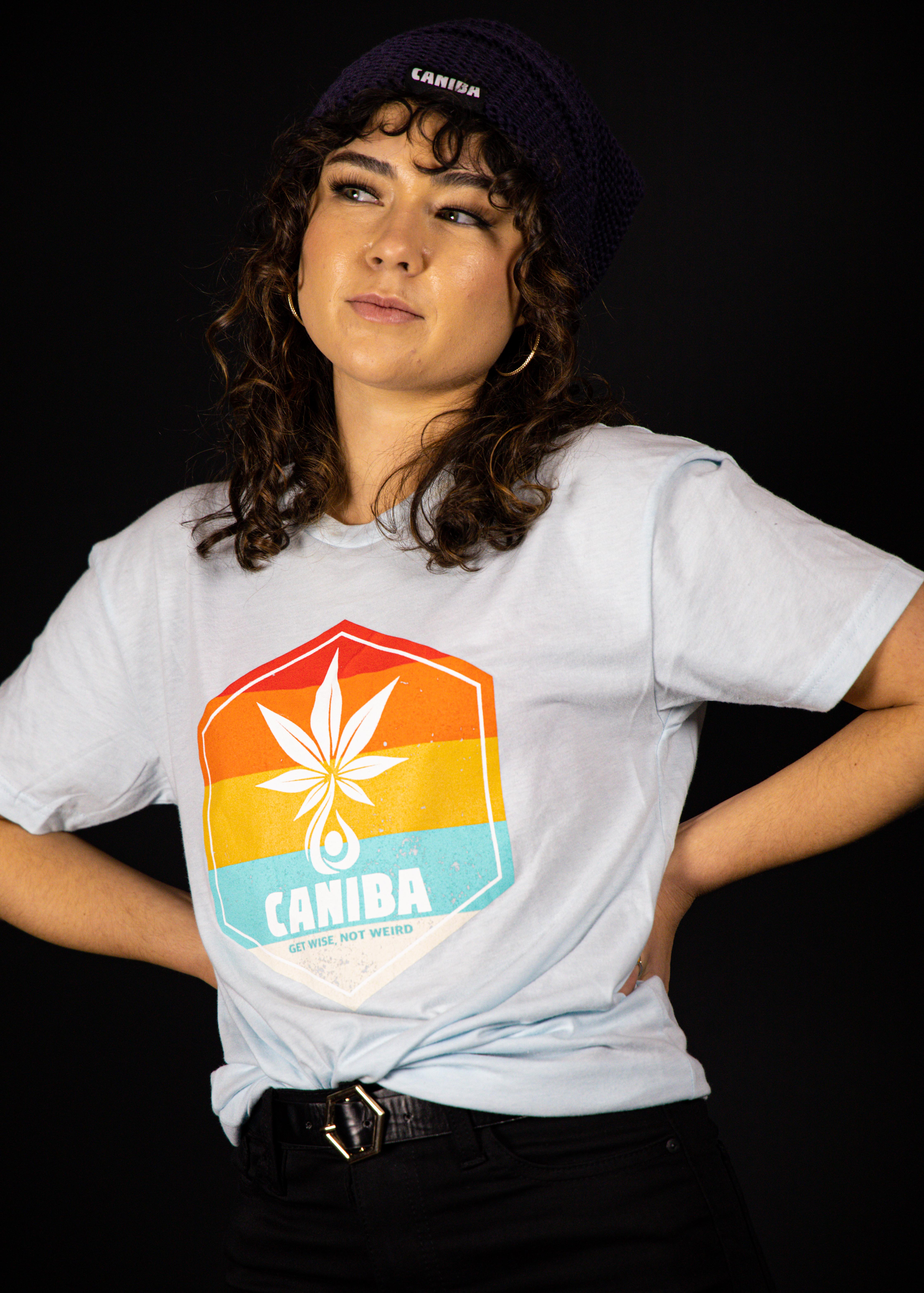 Photograph of product: T-Shirt. XS. Blue. Hexagon Badge. Caniba
