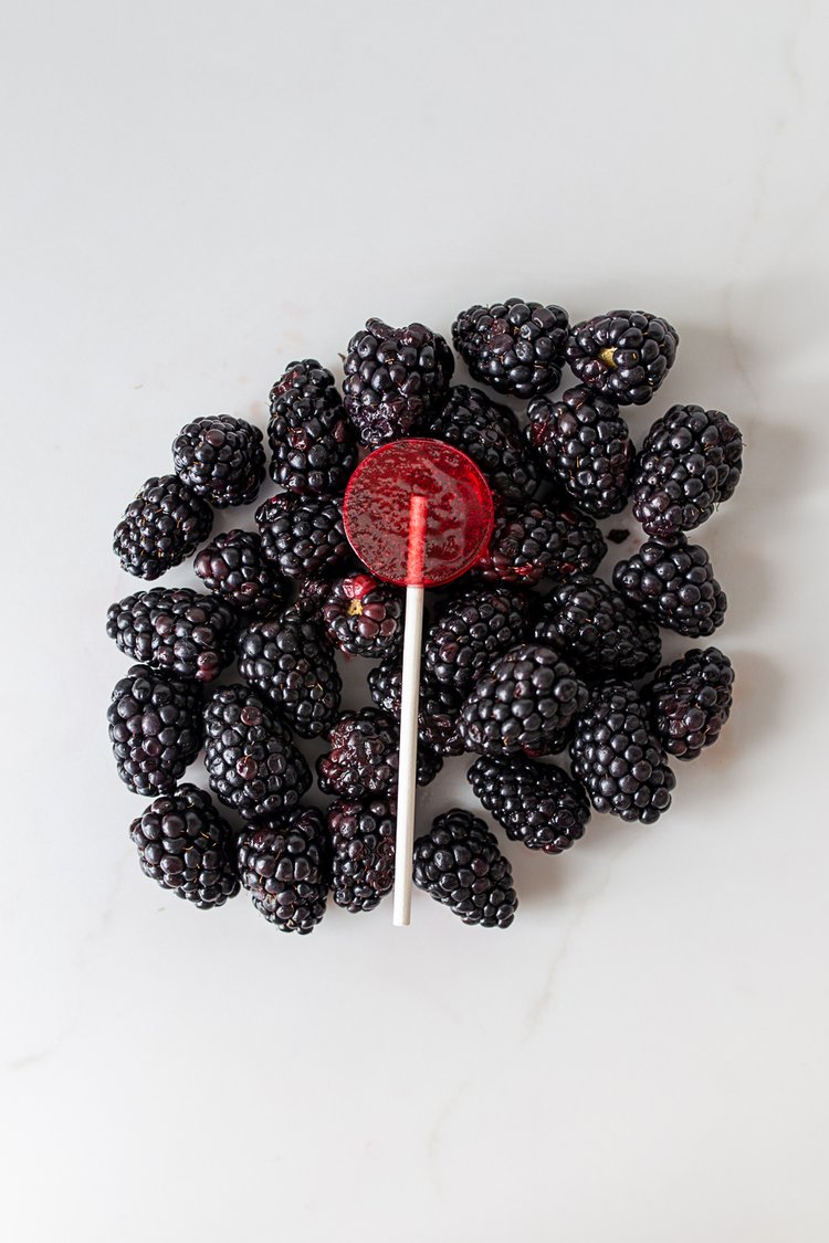 Photograph of product: Zenia // 10mg Black Raspberry Rosin Sucker