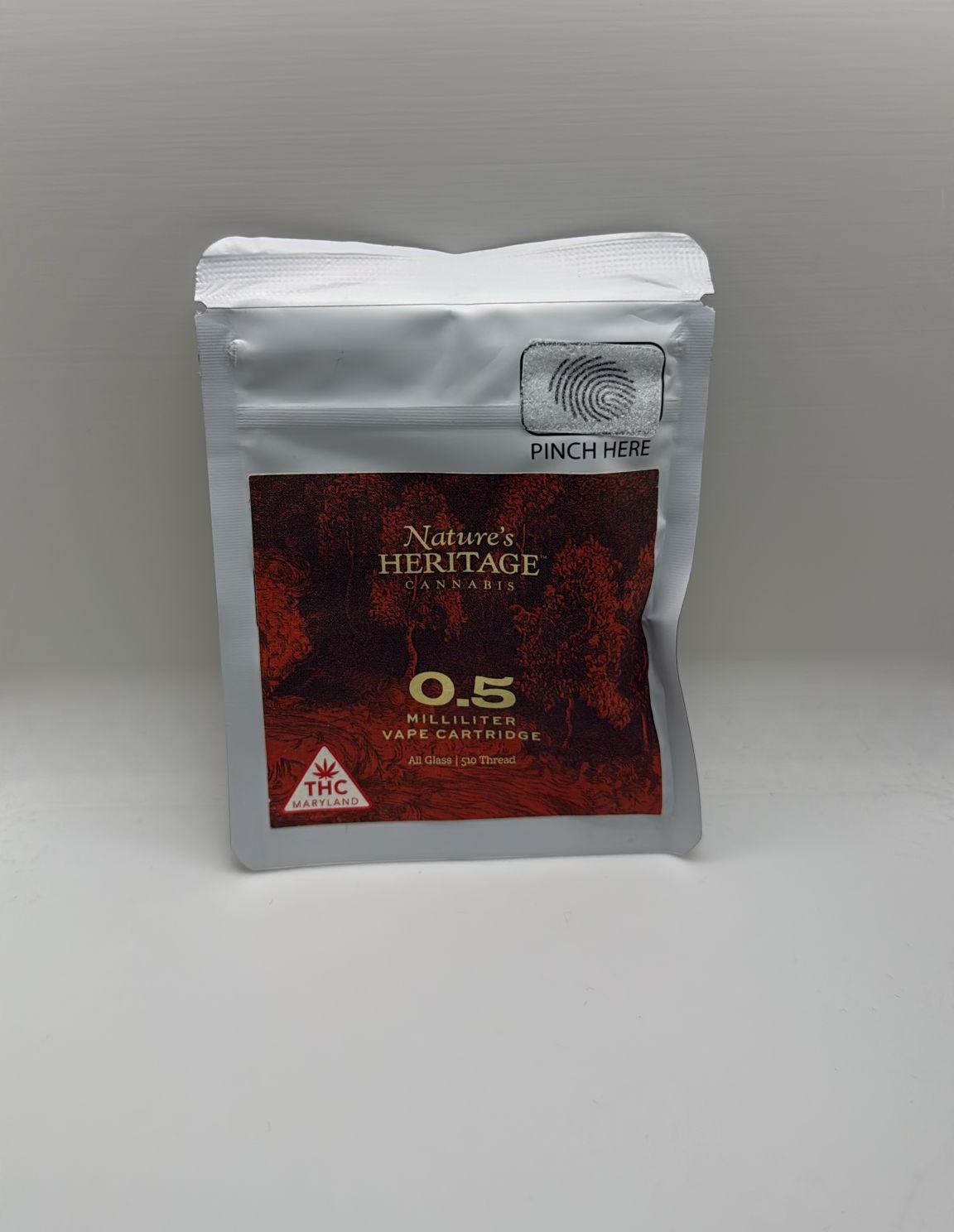 Photograph of Product: Nature's Heritage Peach Pistol Live Resin Cart 0.5g