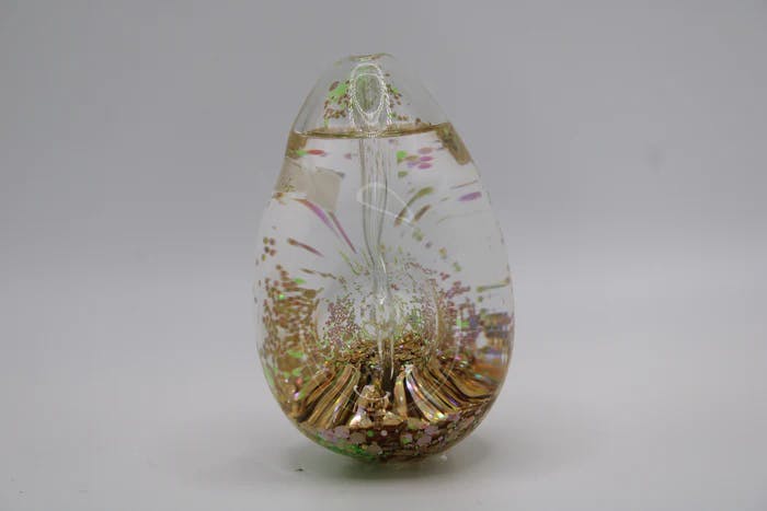 Photograph of product: Cyphe Egg Shaped Glow In The Dark Hand Pipe | Orange