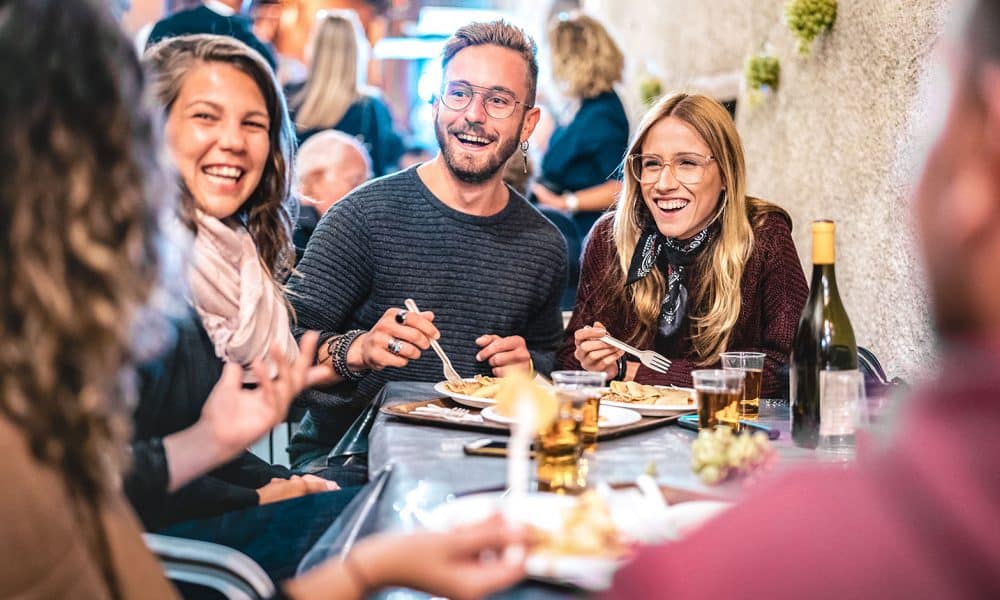 Happy people eating vegan food