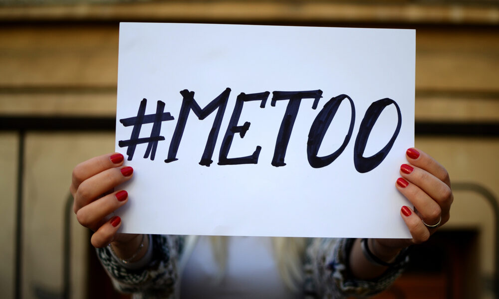 #metoo-woman-holding-up-me-too-sign