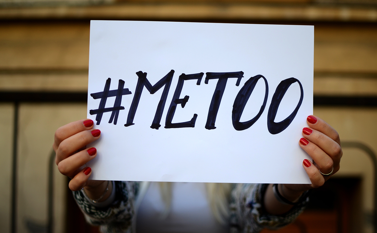 #metoo-woman-holding-up-me-too-sign