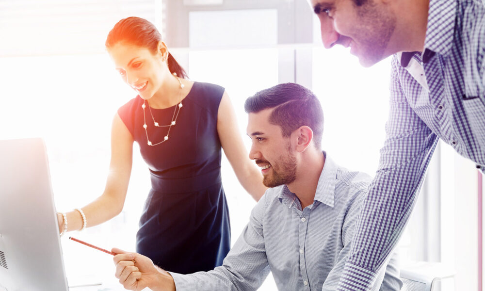 group-of-coworkers-looking-at-a-computer