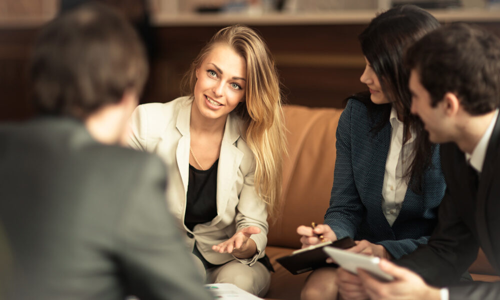 woman-conducting-business-meeting