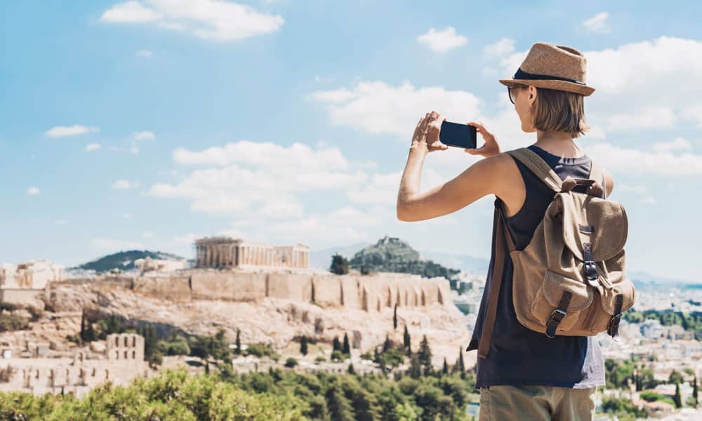 woman taking a photo of nature