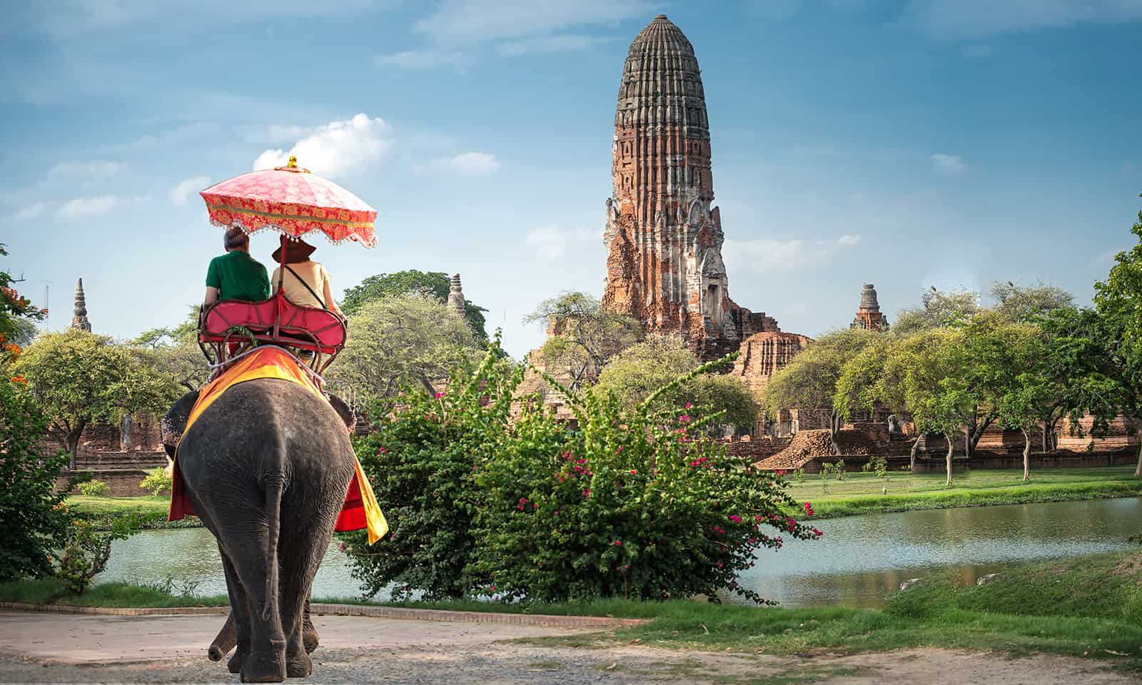 Tourists on an elephant ride tour of the ancient city Ayutaya ,t