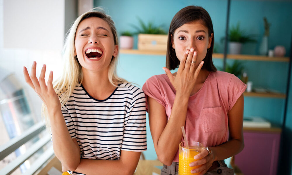 Friendship, happiness and people concept. Young women friends talking and having fun together