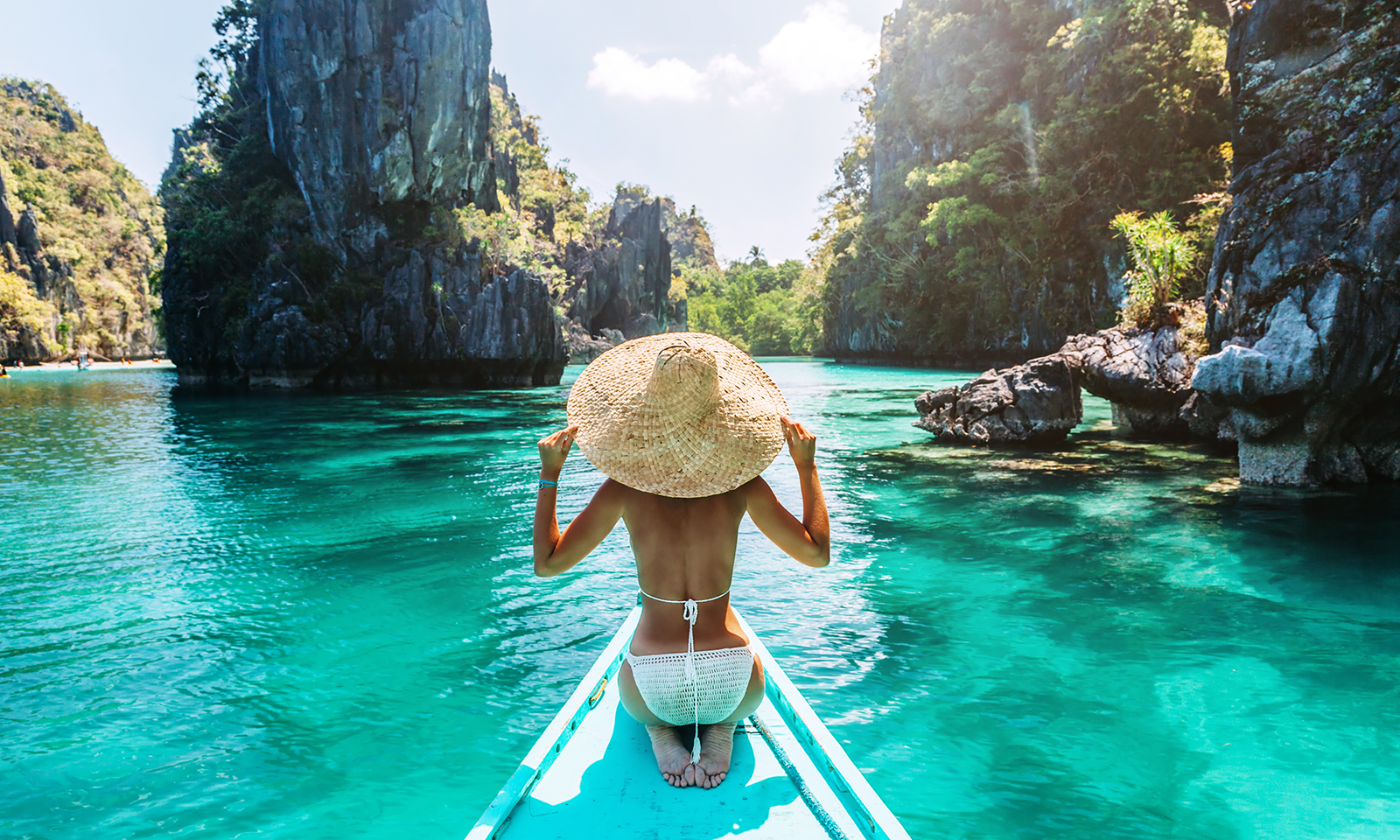 travel-girl-in-boat-in-southeast-asia-beautiful-water-bikini