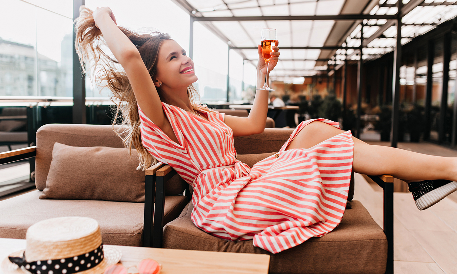 how-to-naturally-boost-oxytocin-happy-girl-enjoying-a-drink