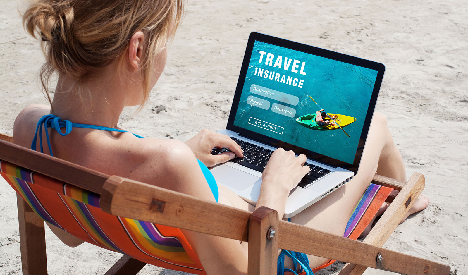 woman-on-beach-travel-insurance-online-shopping